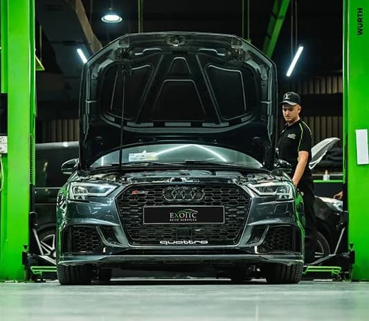 Audi quattro with the bonnet open, receiving a service inspection at the Exotic Auto Services workshop